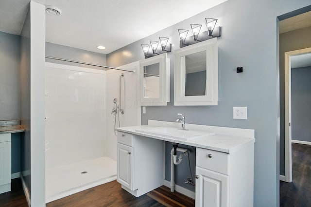820 N Walnut St, Baltimore, OH 43105 - full bath with a sink, wood finished floors, tiled shower, and recessed lighting
