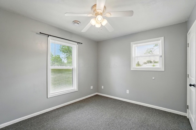820 N Walnut St, Baltimore, OH 43105 - unfurnished room featuring plenty of natural light, dark colored carpet, ceiling fan, and baseboards