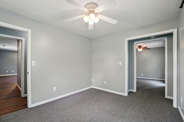 820 N Walnut St, Baltimore, OH 43105 - unfurnished bedroom featuring baseboards, dark carpet, and ceiling fan