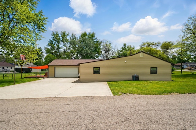 820 N Walnut St, Baltimore, OH 43105 - view of home's exterior with central AC unit, an attached garage, and concrete driveway