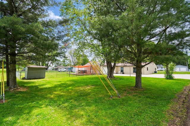 820 N Walnut St, Baltimore, OH 43105 - view of yard with an outdoor structure, a storage shed, and a residential view
