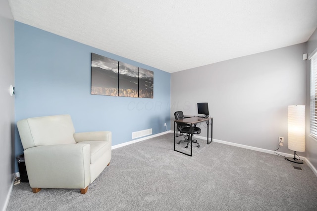 office space featuring carpet flooring and baseboards