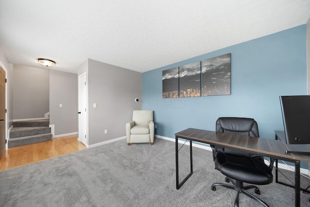 office area with baseboards and carpet floors