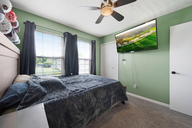 bedroom featuring carpet, a ceiling fan, a textured ceiling, and baseboards