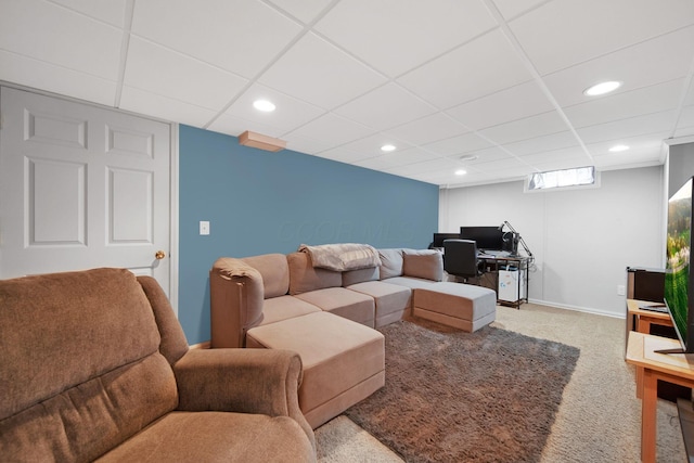 living room featuring a paneled ceiling, carpet flooring, a desk, recessed lighting, and baseboards
