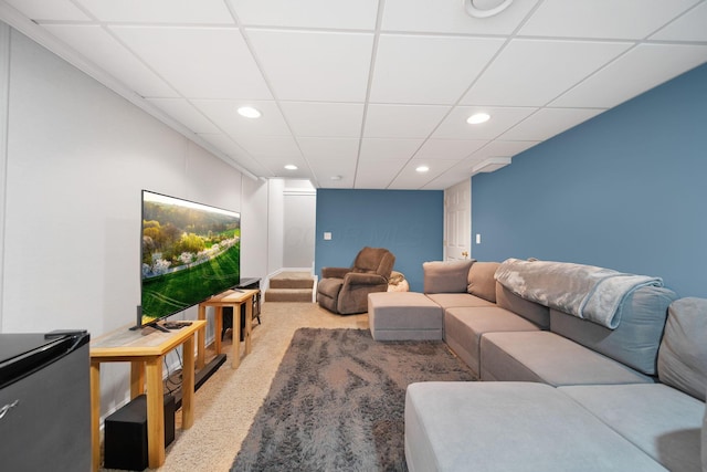 living room featuring recessed lighting and a drop ceiling