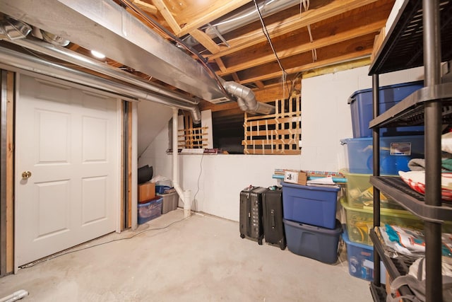 unfinished basement with concrete block wall
