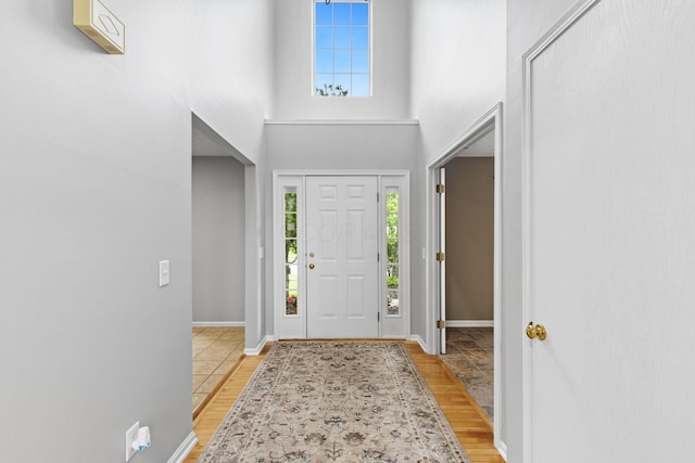 1980 Maxwell Ave, Lewis Center, OH 43035 - foyer with healthy amount of natural light, baseboards, light wood-style floors, and a high ceiling