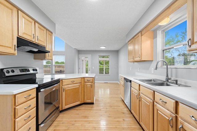1980 Maxwell Ave, Lewis Center, OH 43035 - kitchen with appliances with stainless steel finishes, under cabinet range hood, a sink, light countertops, and a textured ceiling