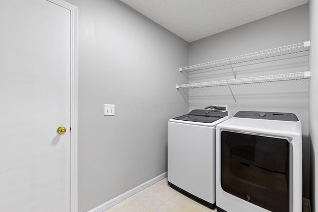 1980 Maxwell Ave, Lewis Center, OH 43035 - washroom featuring washer and dryer, baseboards, and light tile patterned floors