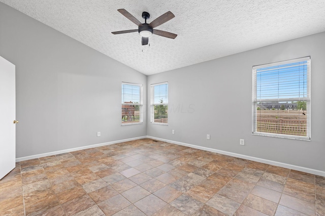 1980 Maxwell Ave, Lewis Center, OH 43035 - unfurnished room with a ceiling fan, baseboards, a textured ceiling, stone finish flooring, and vaulted ceiling