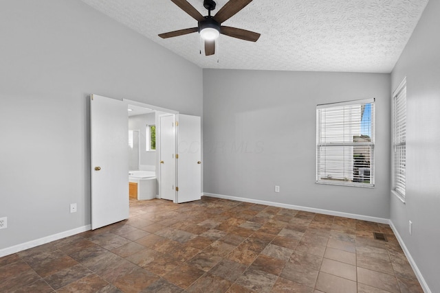 1980 Maxwell Ave, Lewis Center, OH 43035 - unfurnished bedroom featuring a textured ceiling, baseboards, stone finish floors, connected bathroom, and ceiling fan
