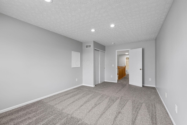 1980 Maxwell Ave, Lewis Center, OH 43035 - unfurnished bedroom with a textured ceiling, a closet, baseboards, carpet flooring, and recessed lighting