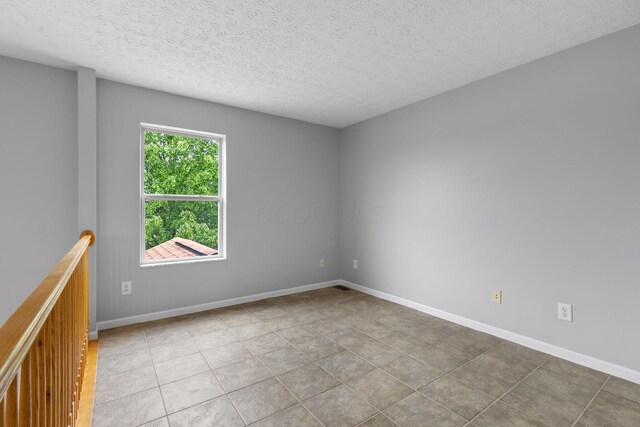 1980 Maxwell Ave, Lewis Center, OH 43035 - tiled spare room with a textured ceiling and baseboards