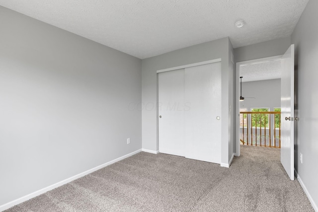 1980 Maxwell Ave, Lewis Center, OH 43035 - unfurnished bedroom featuring a textured ceiling, carpet, a closet, and baseboards