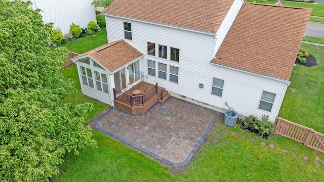 1980 Maxwell Ave, Lewis Center, OH 43035 - rear view of house with a sunroom, roof with shingles, a patio, and a deck
