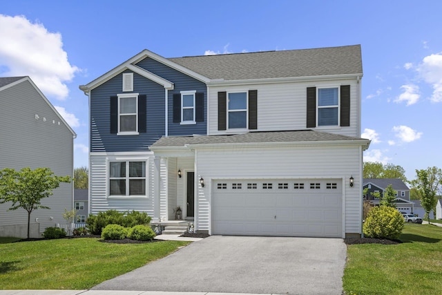136 Bigelow Dr, Johnstown, OH 43031 - traditional home with driveway, a front lawn, and a garage