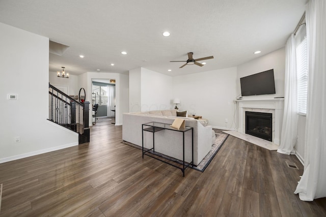136 Bigelow Dr, Johnstown, OH 43031 - living room with stairway, recessed lighting, dark wood finished floors, baseboards, and ceiling fan