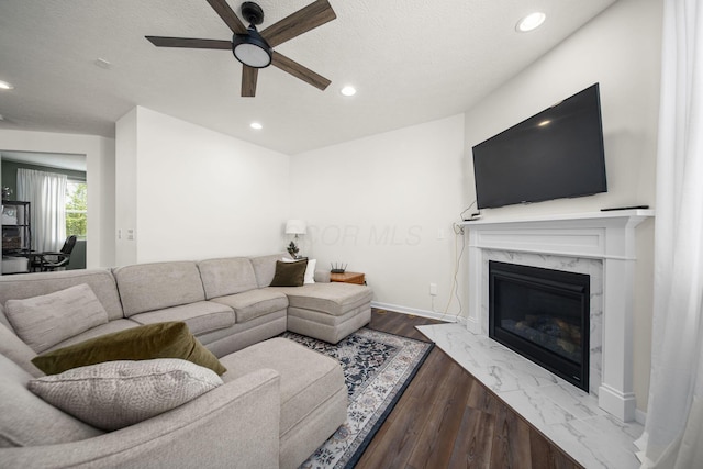 136 Bigelow Dr, Johnstown, OH 43031 - living room featuring a ceiling fan, a fireplace, recessed lighting, wood finished floors, and baseboards