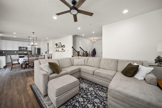 136 Bigelow Dr, Johnstown, OH 43031 - living room featuring a ceiling fan, recessed lighting, dark wood finished floors, and stairs