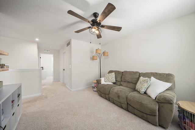 136 Bigelow Dr, Johnstown, OH 43031 - carpeted living area with ceiling fan, baseboards, recessed lighting, and a textured ceiling