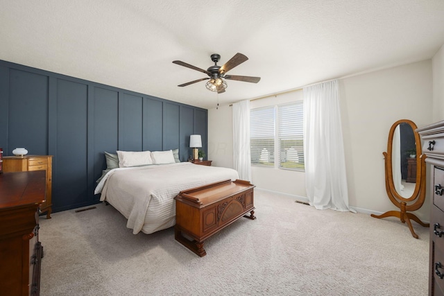 136 Bigelow Dr, Johnstown, OH 43031 - bedroom featuring a decorative wall, ceiling fan, light carpet, and baseboards