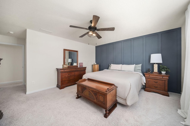 136 Bigelow Dr, Johnstown, OH 43031 - bedroom featuring a decorative wall, light carpet, ceiling fan, and baseboards