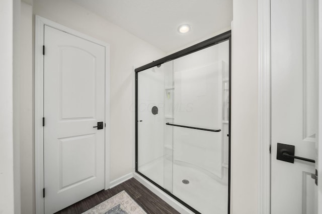 136 Bigelow Dr, Johnstown, OH 43031 - bathroom with wood finished floors, a shower stall, recessed lighting, and baseboards