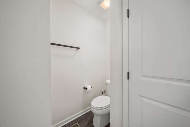 136 Bigelow Dr, Johnstown, OH 43031 - bathroom with wood finished floors, toilet, and baseboards