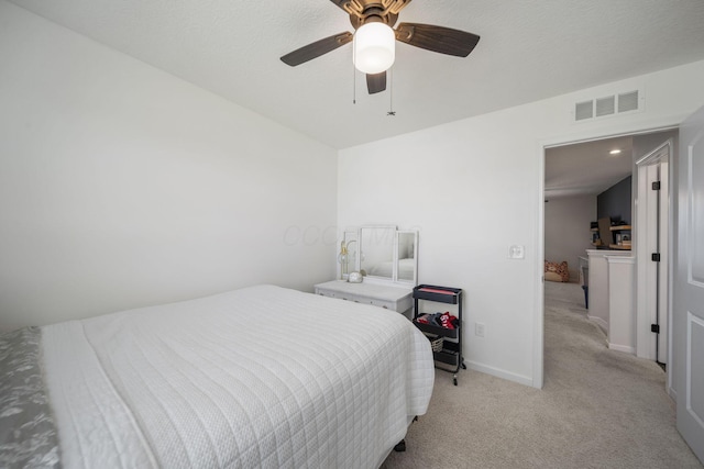 136 Bigelow Dr, Johnstown, OH 43031 - bedroom with light colored carpet, ceiling fan, and baseboards