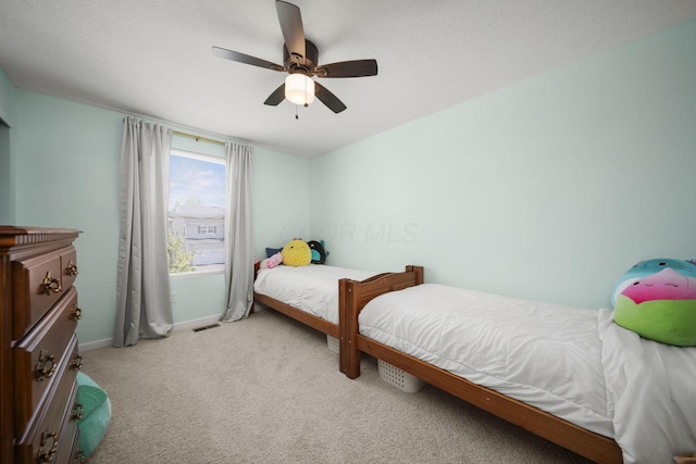 136 Bigelow Dr, Johnstown, OH 43031 - bedroom with light carpet, baseboards, and a ceiling fan
