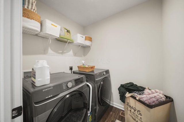 136 Bigelow Dr, Johnstown, OH 43031 - laundry area featuring washer and clothes dryer, dark wood finished floors, and baseboards