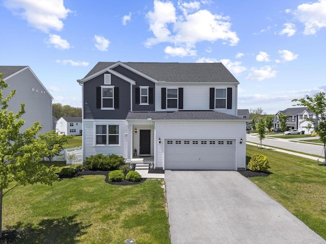 136 Bigelow Dr, Johnstown, OH 43031 - traditional home with asphalt driveway, a garage, and roof with shingles