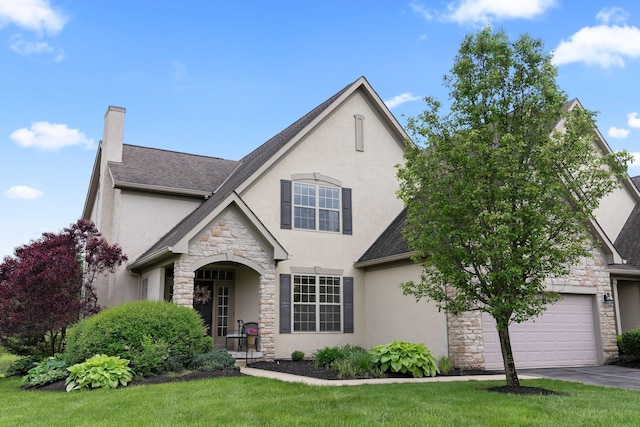 6755 Arbor View Ct, Powell, OH 43065 - french provincial home with stone siding, stucco siding, a front yard, and asphalt driveway
