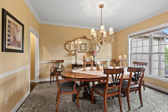 6755 Arbor View Ct, Powell, OH 43065 - dining area with crown molding, a chandelier, baseboards, and wood finished floors