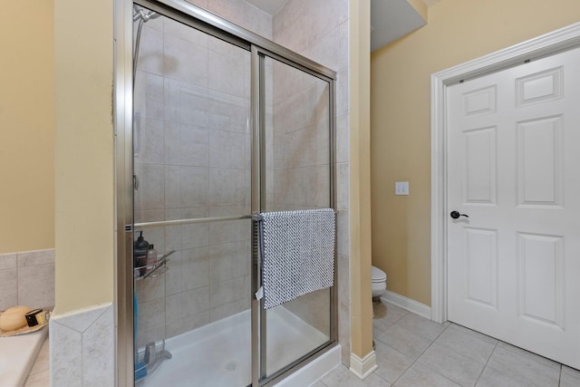 6755 Arbor View Ct, Powell, OH 43065 - bathroom featuring a stall shower, tile patterned floors, and toilet