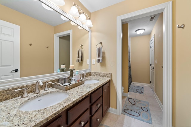 6755 Arbor View Ct, Powell, OH 43065 - bathroom featuring tile patterned flooring, toilet, double vanity, a shower with shower curtain, and baseboards