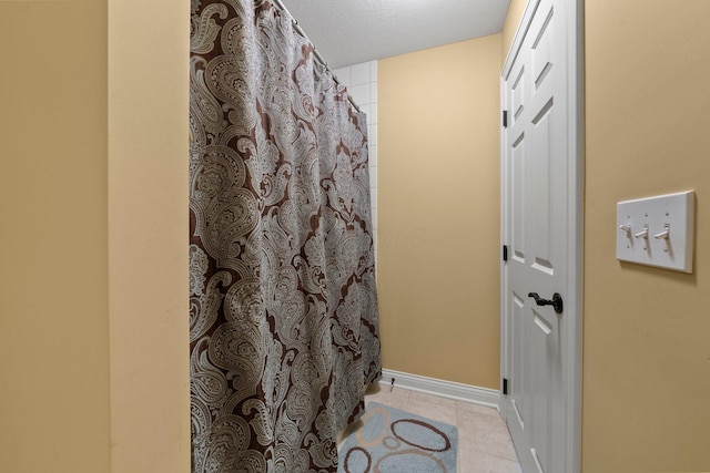 6755 Arbor View Ct, Powell, OH 43065 - full bathroom featuring tile patterned floors, a shower with shower curtain, and baseboards
