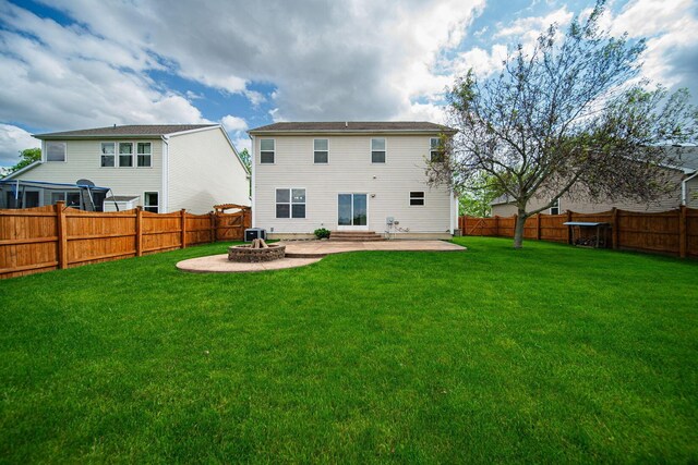1019 Wallace Dr, Delaware, OH 43015 - back of house with an outdoor fire pit and a patio