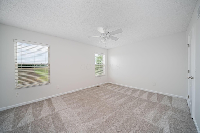 1019 Wallace Dr, Delaware, OH 43015 - unfurnished room with carpet flooring, ceiling fan, baseboards, and a textured ceiling