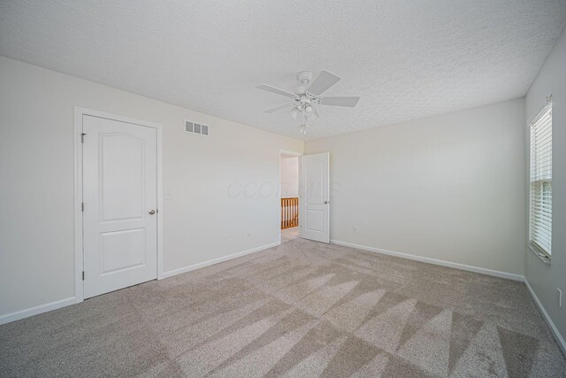 1019 Wallace Dr, Delaware, OH 43015 - carpeted empty room with a ceiling fan, a textured ceiling, and baseboards