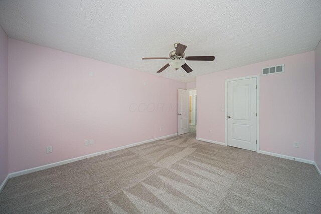 1019 Wallace Dr, Delaware, OH 43015 - unfurnished bedroom featuring carpet, a textured ceiling, baseboards, and ceiling fan