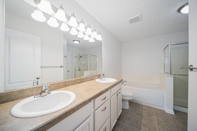1019 Wallace Dr, Delaware, OH 43015 - full bathroom with a shower stall, tile patterned flooring, a garden tub, double vanity, and toilet