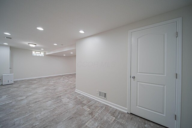 1019 Wallace Dr, Delaware, OH 43015 - below grade area featuring wood finished floors, recessed lighting, and baseboards