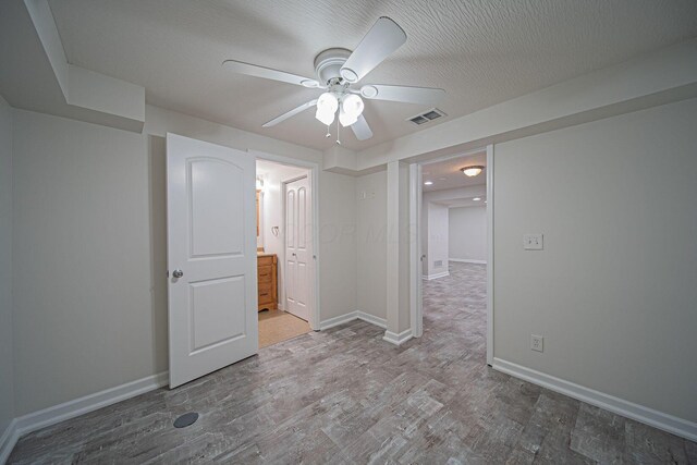 1019 Wallace Dr, Delaware, OH 43015 - unfurnished bedroom featuring wood finished floors, baseboards, ensuite bath, and ceiling fan