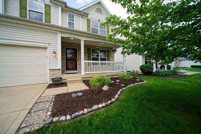 1019 Wallace Dr, Delaware, OH 43015 - view of front of property featuring a porch, stone siding, and a front yard