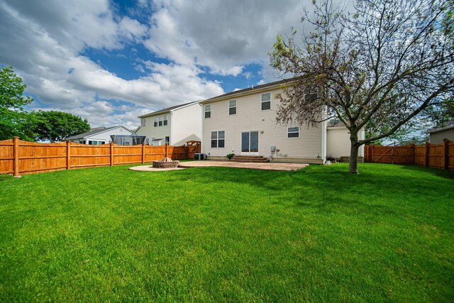 1019 Wallace Dr, Delaware, OH 43015 - rear view of property featuring a fire pit and a patio