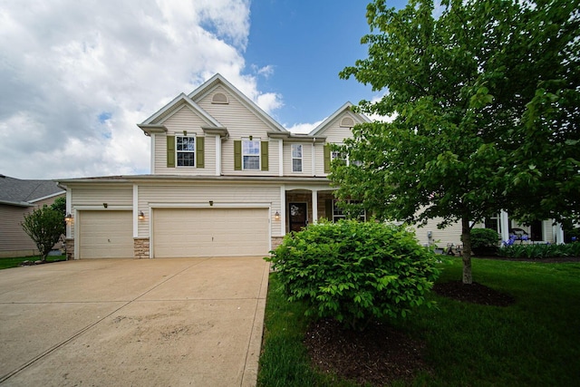 1019 Wallace Dr, Delaware, OH 43015 - view of front of home with driveway, an attached garage, a front yard, and stone siding