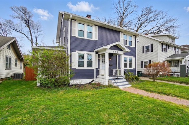 114 Roosevelt Dr, Springfield, OH 45504 - view of front facade featuring central AC unit, a front yard, and a chimney