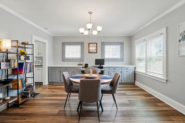 114 Roosevelt Dr, Springfield, OH 45504 - dining space featuring wallpapered walls, ornamental molding, a chandelier, baseboards, and dark wood finished floors